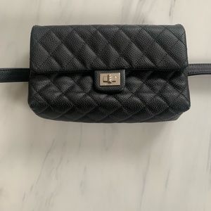 Chanel uniform black waist bag.